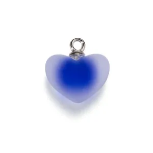 Close-up of blue frosted heart acrylic pendant with silver bail for DIY jewelry making