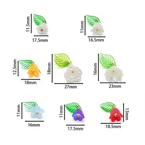 Detail showing multiple sizes and colors of acrylic lily of the valley flower pendants