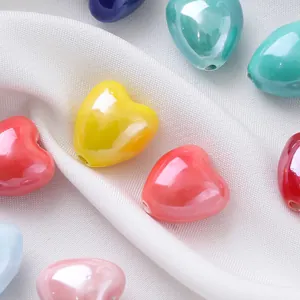 Close-up of 12x13mm colorful heart-shaped ceramic beads for DIY jewelry making.