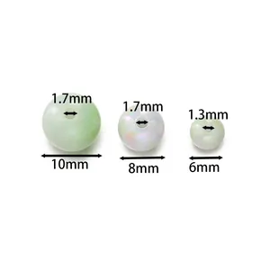 Vista dettagliata di perle tonde in acrilico iridato da 6mm 8mm 10mm con misure fori