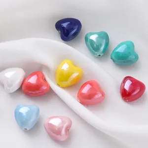 Detailed view of colorful candy-colored heart-shaped ceramic beads for DIY jewelry