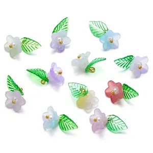 Macro detail of colorful acrylic flower and leaf pendants for DIY jewelry making