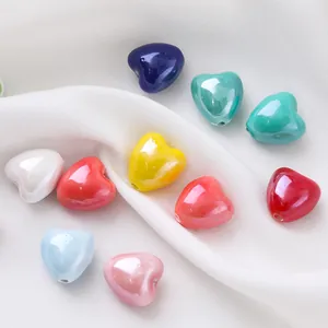 Close-up of colorful candy-colored heart ceramic beads for DIY jewelry making.