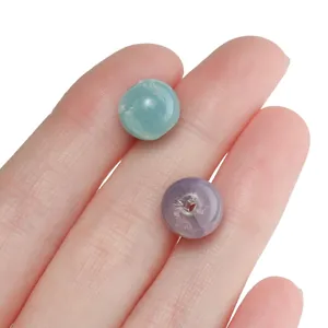 Close-up of 10mm round crackle glass beads with internal texture for DIY jewelry