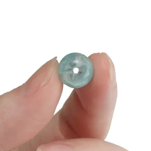 Detailed close-up of a 10mm light blue cracked glass bead for DIY jewelry making