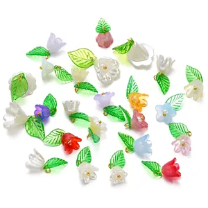 Detailed view of colorful acrylic flower and leaf pendants for DIY accessories