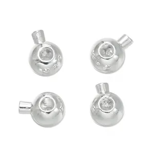 Detail view of silver-tone metallic jewelry end findings for DIY beading and necklaces