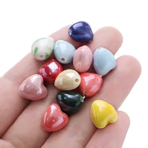 Detailed view of mixed candy-colored 12x13mm heart ceramic beads for DIY jewelry