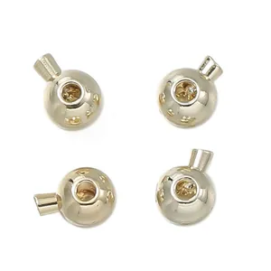 Detail shot of 18K gold-plated spherical end caps for professional DIY jewelry making