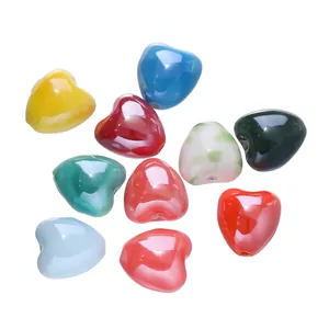 Detail view of assorted colorful 12x13mm heart-shaped ceramic beads for DIY jewelry