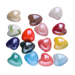 Detailed macro view of colorful heart-shaped ceramic beads for DIY jewelry making crafts