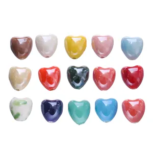 Various candy-colored heart-shaped ceramic beads for DIY handmade jewelry making projects.