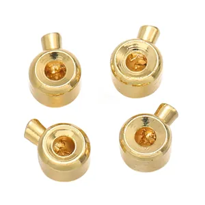 Close-up macro detail of gold-plated bead stoppers for DIY jewelry necklace finishing
