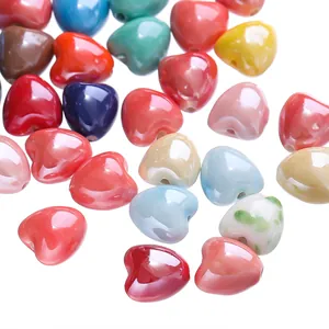 Close-up view of vibrant 12x13mm candy colored heart ceramic beads for DIY jewelry making crafts