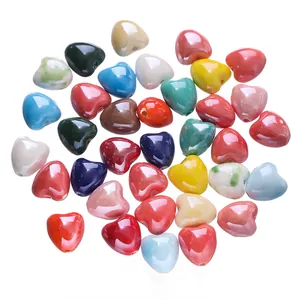 Macro view of colorful candy-toned heart-shaped ceramic beads for DIY crafts