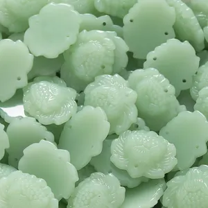 Macro detail of light green lotus leaf carved glass beads for DIY jewelry making