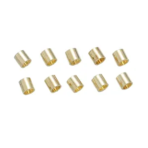 Close-up of ten 18K gold-plated cylindrical crimp beads for DIY jewelry making