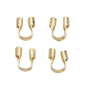 Close-up of four 18K gold plated U-shape wire protectors for DIY jewelry making