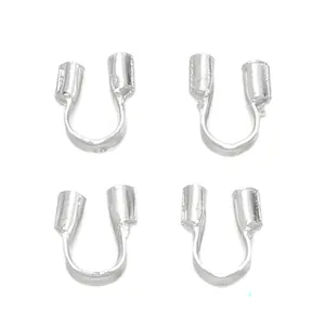 Macro detail of silver-colored jewelry wire guards for handmade necklace and bracelet DIY.
