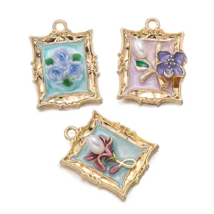 Macro view of retro alloy frame charms with enamel flower and pearl details for DIY.