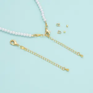 Close-up of 18K gold-plated lobster clasps and extension chains for pearl jewelry