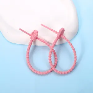 Adorable pink silicone cat paw cable tie for data cable management and DIY projects