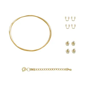 Detailed view of 18K gold-plated DIY jewelry making kit with wire, beads, and clasps
