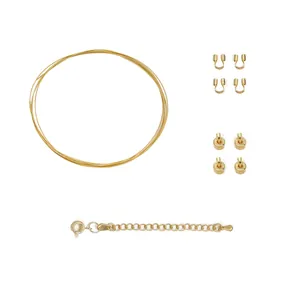 Detailed view of 18K gold-plated DIY jewelry kit including wire, crimps, and clasp