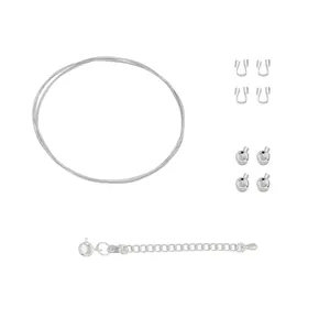Detailed view of DIY jewelry making kit with steel wire and various silver-toned components