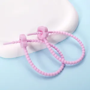 Pink adjustable silicone cable tie with cute flower buckle for data cable management