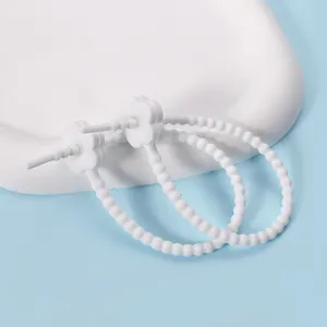 White silicone cable tie with flower design, flexible cord organizer for data cables