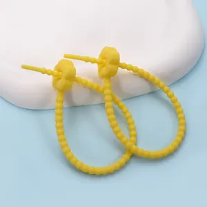 Adjustable yellow silicone flower cable tie for cable organization and DIY charms
