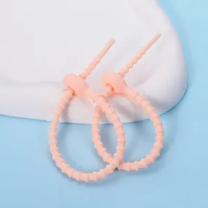 Adjustable pink silicone cable tie for efficient data cable storage and DIY organizing