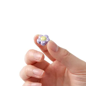 Macro view of a colorful iridescent flower bead for DIY jewelry making