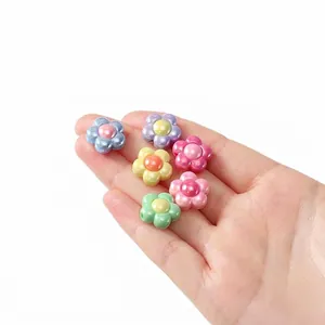 Detail of high-gloss colorful acrylic flower beads for DIY jewelry making.