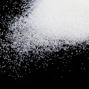 Close-up detail of iridescent no-hole glass micro-beads for DIY nail art and crafts