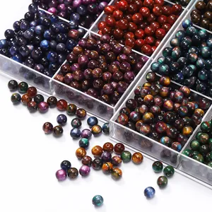 Detailed view of multi-colored two-tone resin cat-eye round beads for DIY jewelry making