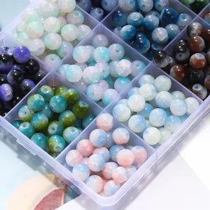 Close-up of colorful 8mm ice-crack glass beads stored in a clear organizer box.