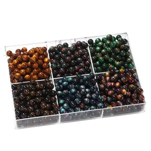 Assorted double-colored resin cat's eye beads in a clear 6-compartment organizer.