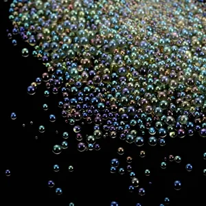 Macro view showing the iridescent shimmer of transparent no-hole glass bubble beads for nail art