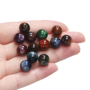 Macro view of assorted colorful resin cat eye beads for handmade jewelry and DIY crafts