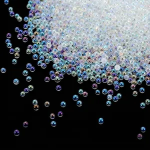 Macro view of iridescent mini glass bubble beads for nail art DIY crafts decorations