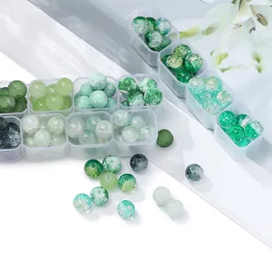 Detailed macro view of assorted green glass beads for DIY jewelry making craft kits