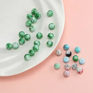 Detailed view of green marble pattern round beads for DIY bracelet and jewelry making crafts