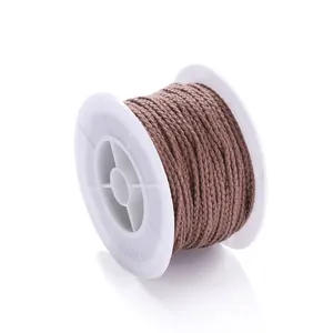 Durable brown braided cord on a spool for DIY jewelry making and handmade crafting.