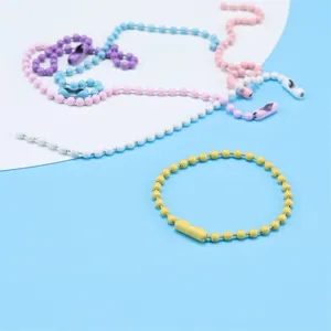 Close-up detail of colorful painted ball bead chains with connectors for DIY jewelry