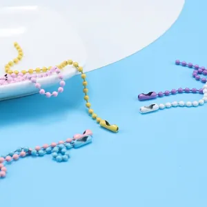 Detailed view of colorful painted metal ball chains for DIY handmade keychain accessories.