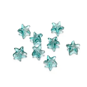 Macro view of transparent teal glass starfish beads featuring unique internal bubble textures