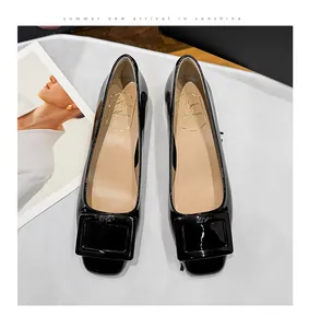 Elegant black patent leather flat shoes with square buckle detail and low block heel