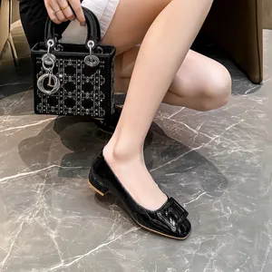 Black patent leather square buckle pumps with low chunky heel for office commute
